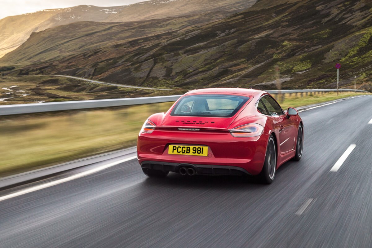 2015 Porsche Cayman GTS on the road rear view