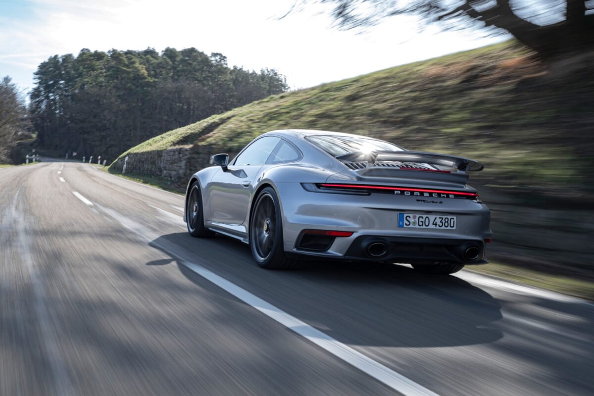2021 Porsche 911 Turbo S on the road rear view