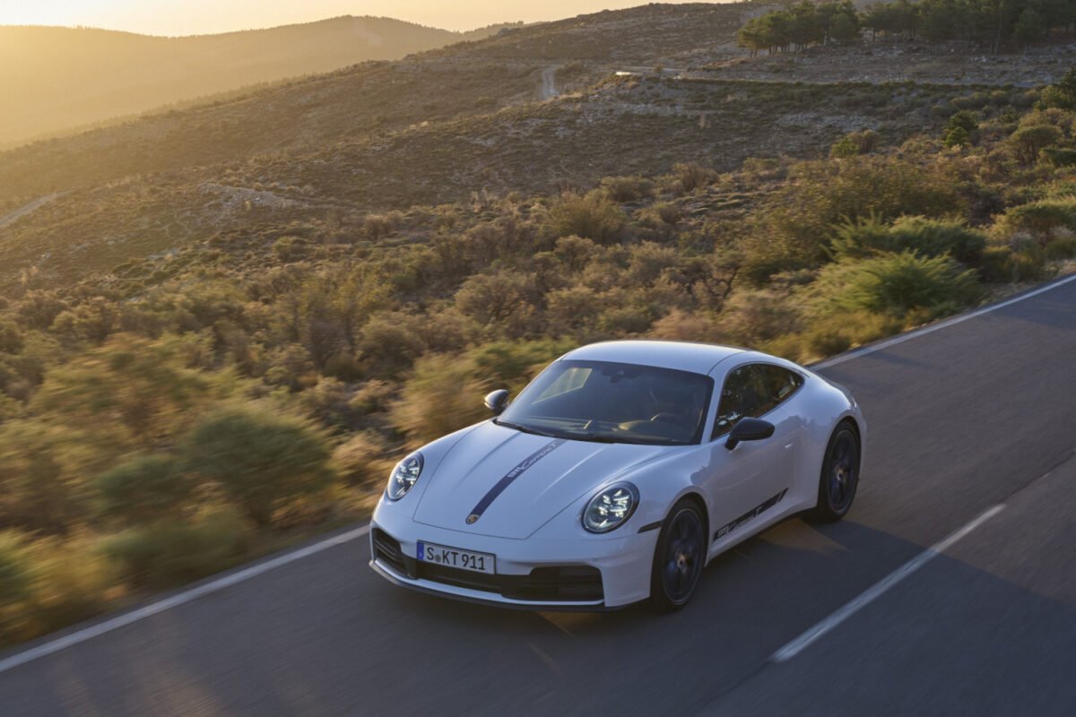 2025 Porsche 911 Carrera T on the road at sunset front