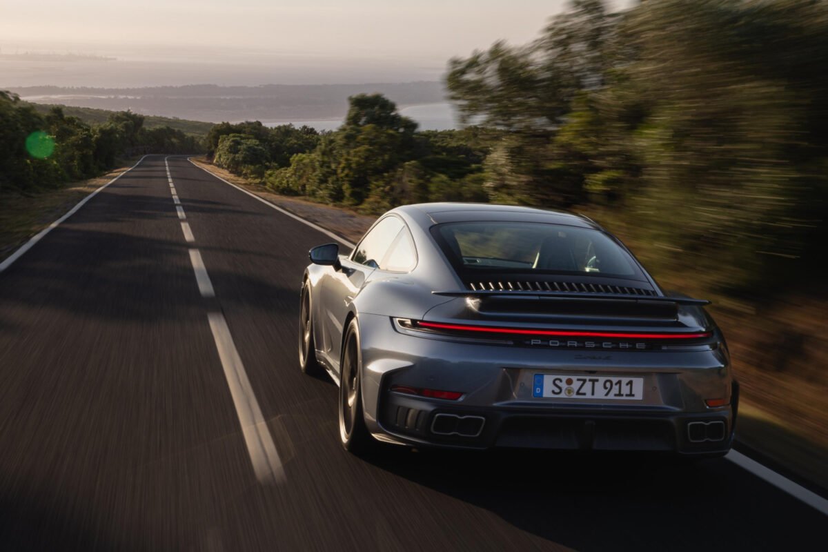 2026 Porsche 911 Turbo S on the road rear view
